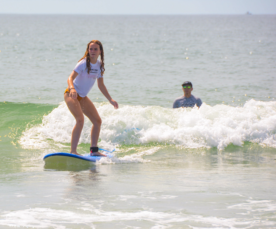 Photo of girl in Wilmington NC having a surf lesson with Topsail Surf Adventures